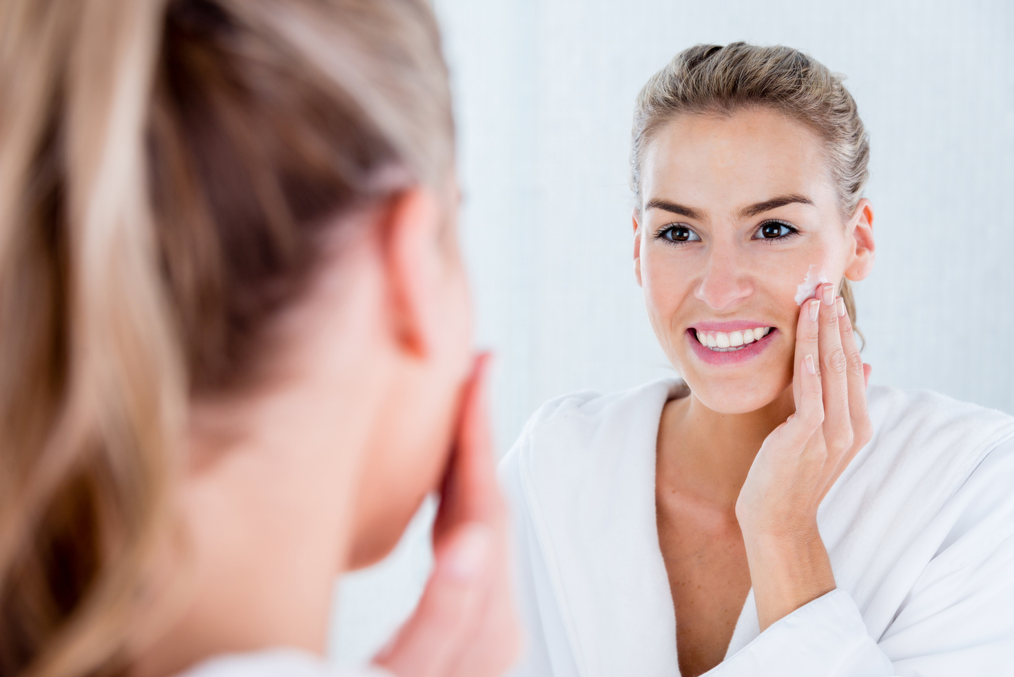 Woman hydrating her skin